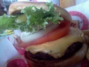 Bacon Cheeseburger with 1/4 Lb Meat, Mayonnaise or Salad Dressing and Tomatoes on Bun