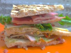 Ham and Tomato Club Sandwich with Lettuce and Spread
