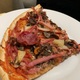 Thin Crust Pizza with Meat and Vegetables