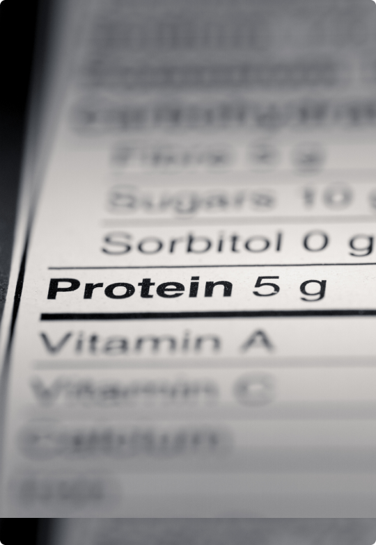 blurred nutrition data label highlighting protein of 5 grams