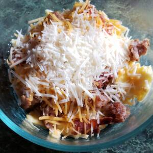 Breakfast Bowl with Eggs, Cheese, Bacon & Sausage